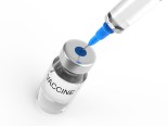 Syringe and vaccine  bottle on white background