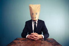 relaxed-businessman-bag-over-head-37556495